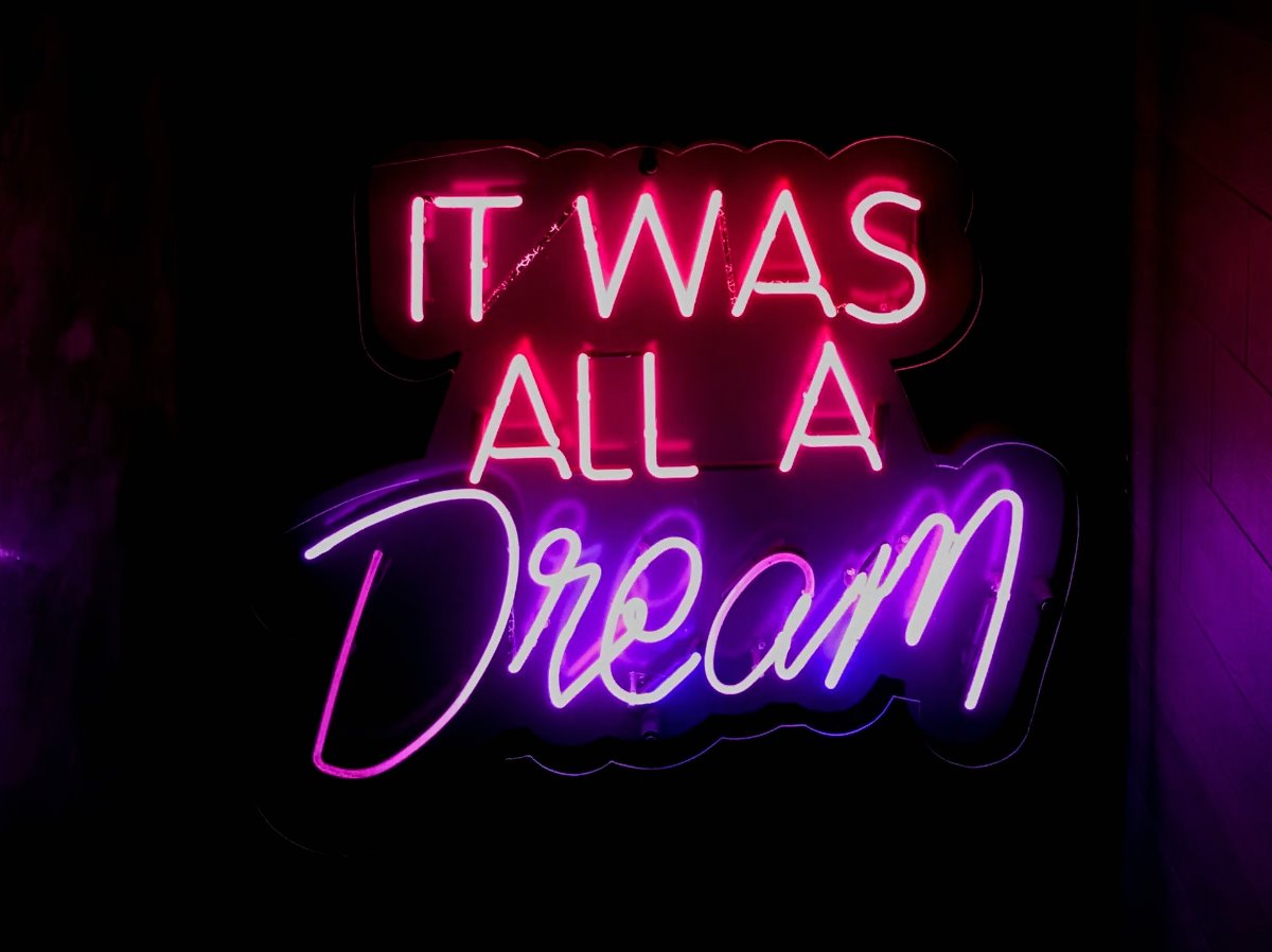 Neon sign reading 'It was all a dream'