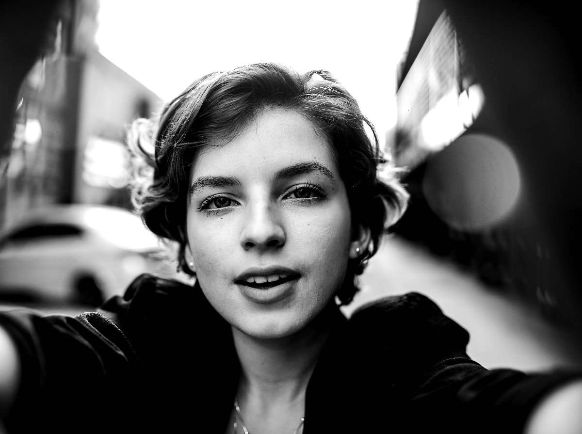A monochrome photo of a young woman with short hair