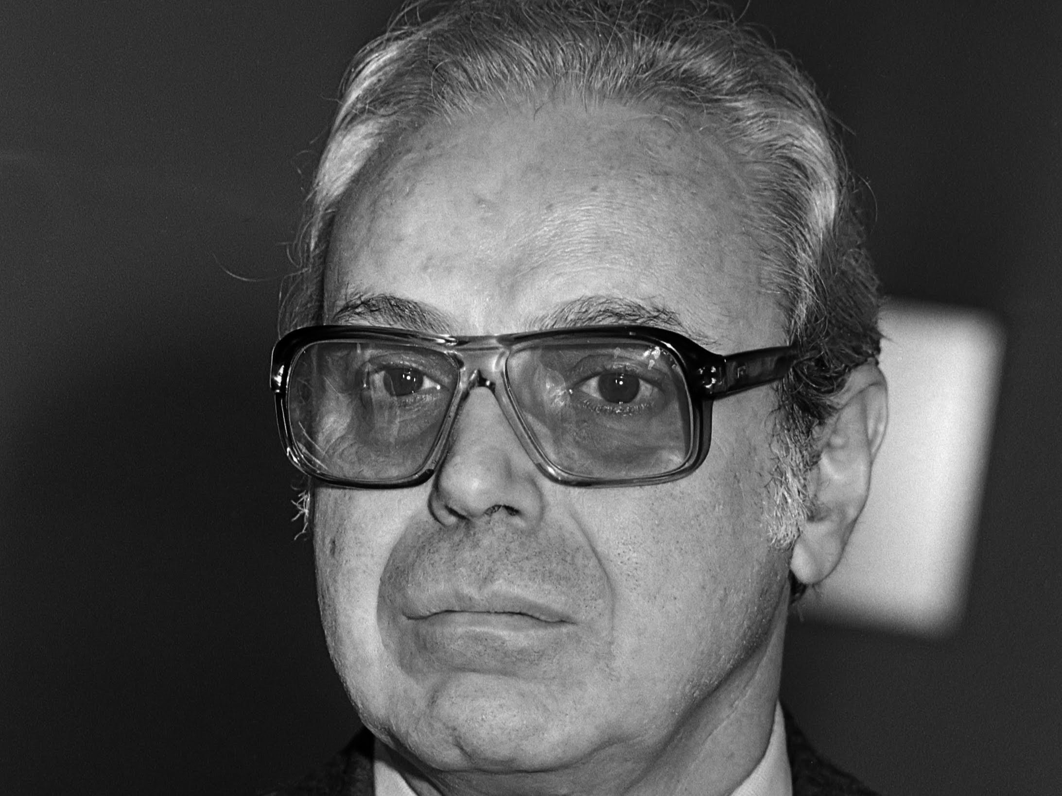 A black and white portrait of UN Secretary-General Javier Pérez de Cuéllar