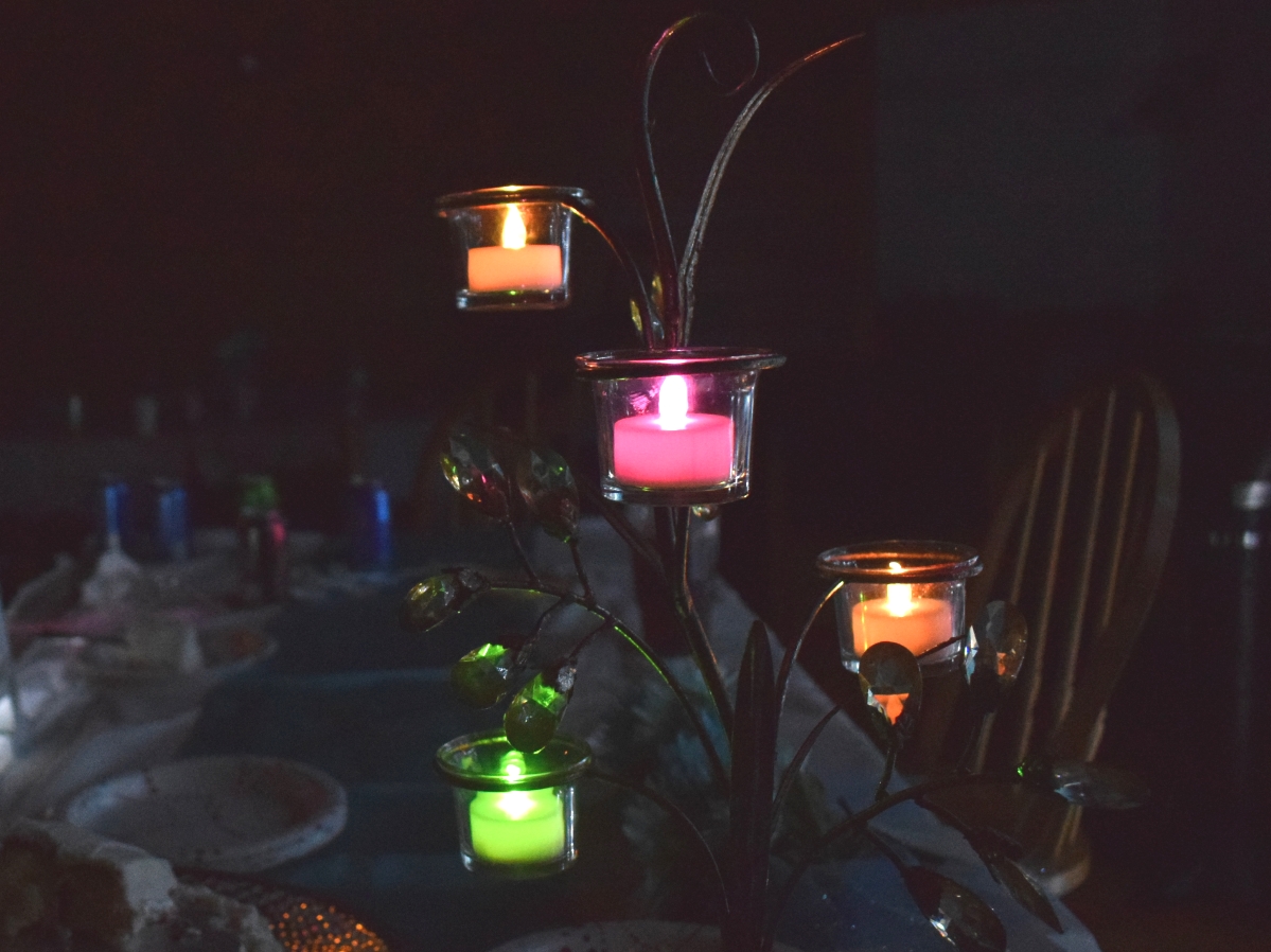 Multicolored tealights in a candleholder